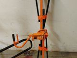 a picture of an orange and black jack stands in a garage