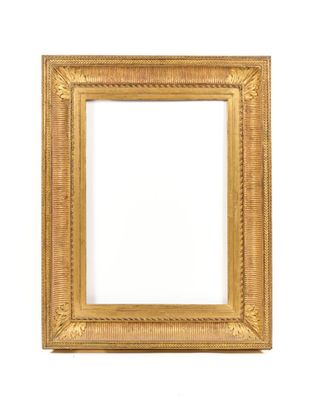 a gold frame on a white wall with a white background