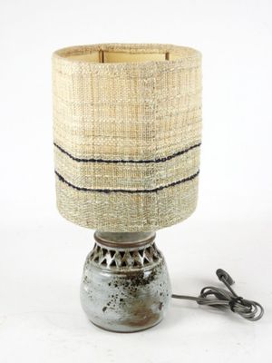 a lamp that is sitting on a table next to a cord