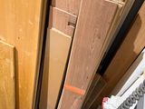 several pieces of wood are stacked on top of each other in a room