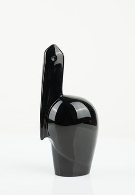 an image of a black vase on a white surface