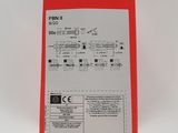 a close up of a red box on a white surface