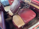 a red car with leather seats and a steering wheel