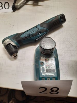 a cordless drill and a cordless hammer on a table