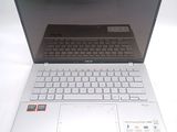 a laptop computer that is sitting on a white table