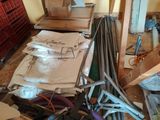 a pile of assorted items on the floor in a room