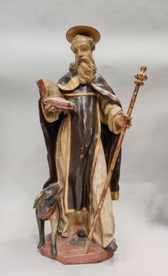 figurine représentant un homme tenant un livre et un bâton