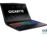 gigabyte laptop with a keyboard and mouse on top of it