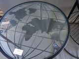 a glass table with a map of the world on it