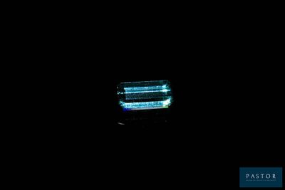 an image of a close up of a toothbrush in the dark