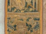 a picture of a wall hanging on the wall of a room