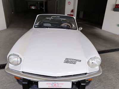 a white car that is parked in a garage