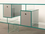 a glass shelf with two cubes on top of it