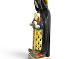 figurine of a monk holding a baby in his arms