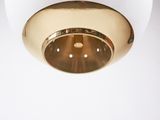 a close up of a white and gold ceiling light