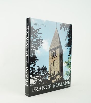 a book with a picture of a church tower in the background
