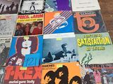 several records are stacked on top of each other on a table