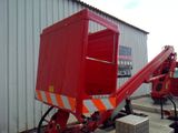 a red truck that is parked in front of a building