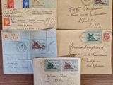 several old envelopes sitting on top of a wooden table next to each other