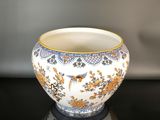 a close up of a vase on a table