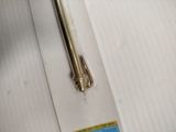 a metal object that is on a piece of paper