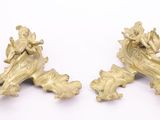 pair of antique brass figurines on a white background