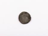 a close up of a coin on a white surface