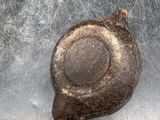 a snail that is sitting on top of a metal surface