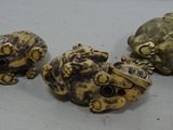 five different types of carved beads sitting on a white surface