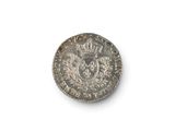 an image of a silver coin on a white surface