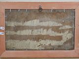 an old picture of a wooden frame hanging on a wall