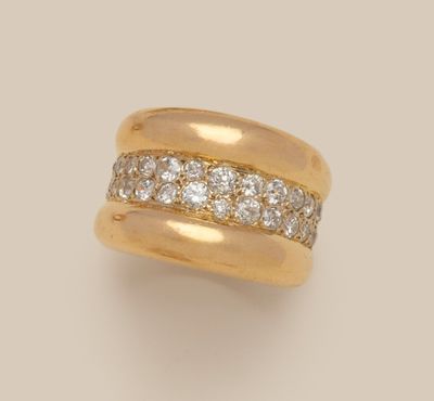 an 18k yellow gold and diamond band ring