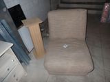 a chair that is sitting in the corner of a room