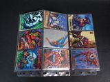 a collection of comic books on display on a table