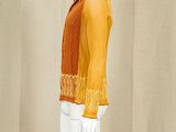a mannequin wearing a yellow shirt and white pants