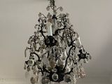 a chandelier hanging from the ceiling in a living room