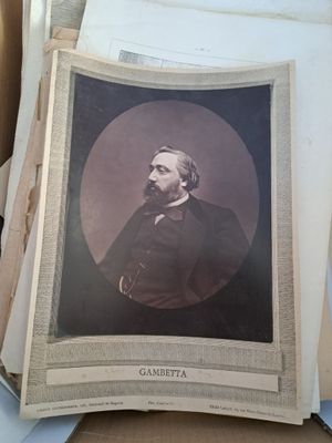 a picture of a man in a suit sitting in a box