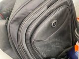 several pieces of luggage are stacked on top of each other
