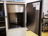 an image of a commercial refrigerator in a kitchen