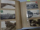 an open book with pictures on it on a table