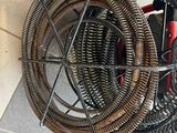 a lot of hoses that are sitting on the floor