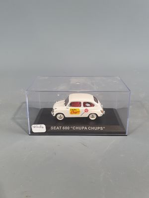 a small white car in a clear box