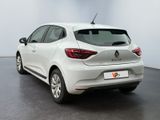 the rear end of a white car parked in a room