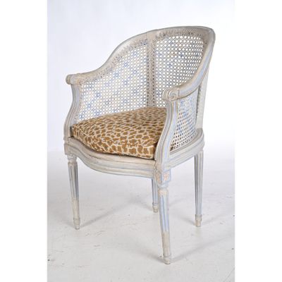 an image of a white chair with a leopard print cushion
