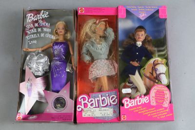 three barbie dolls are lined up in a row on a table