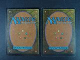 two decks of magic the gathering deck cards on a table