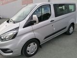 a silver van that is parked in a parking lot
