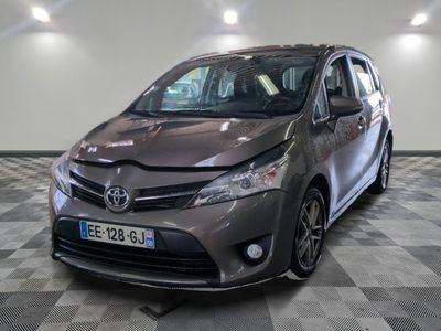 the toyota sienna is parked on a checkered floor in a garage