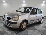 a picture of a silver car parked on a checkered floor
