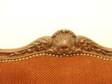 an image of a close up of a chair with an orange upholstered seat